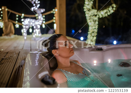 Woman relaxing in a hot tub. Single woman celebrating Valentine's Day alone. Banner with copy space. Woman relaxing in a hot tub. Single woman celebrating Valentine's Day alone. Banner with copy space. 122353139