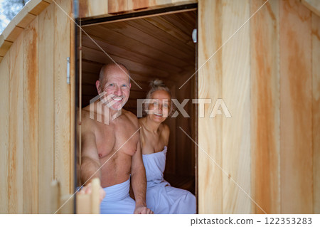 A spa sauna session for elderly man and woman. Romantic spa moment for seniors. 122353283