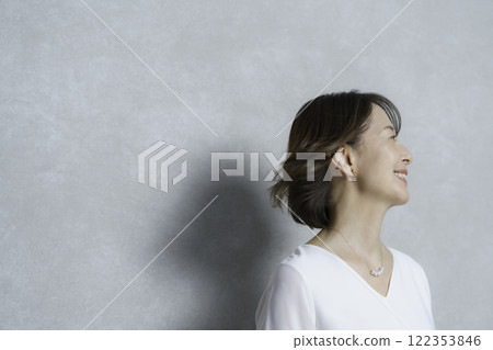 Portrait of a middle-aged woman with bob hair blowing in the wind Anti-aging Hair care 122353846