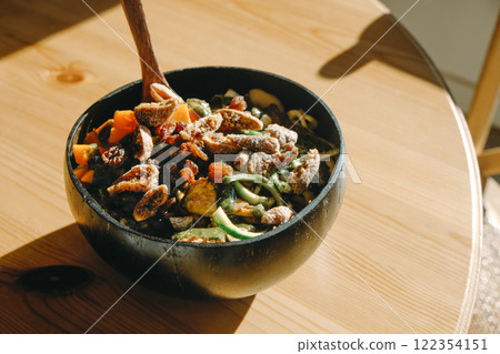 coconut bowl with salad on a table 122354151