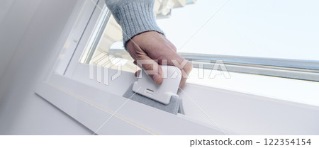 man cleans a white sliding window, web banner man cleans a white sliding window, web banner 122354154