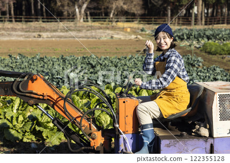 Scene of a woman working in the fields 122355128