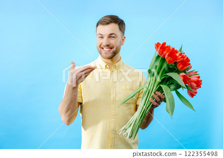 Man holding bouquet of red tulips Man holding bouquet of red tulips 122355498