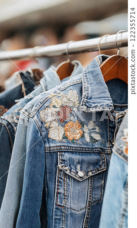 Sustainable second-hand items promoting zero waste lifestyle: Detailed shots of vintage denim jackets 122355714