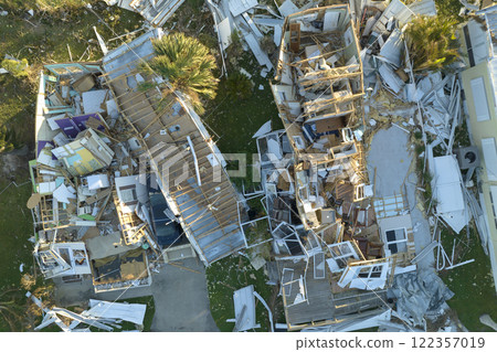 Aerial view of natural disaster consequences in Florida Southwest region. Severely damaged by hurricane Ian mobile homes in residential area 122357019