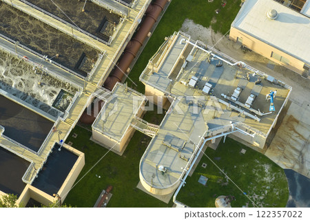 Aerial view of modern water cleaning facility at urban wastewater treatment plant. Purification process of removing undesirable chemicals, suspended solids and gases from contaminated liquid 122357022