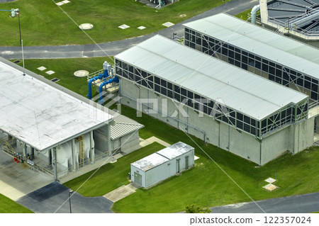 Aerial view of modern water cleaning facility at urban wastewater treatment plant. Purification process of removing undesirable chemicals, suspended solids and gases from contaminated liquid 122357024