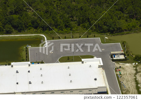 Aerial view of industrial park with goods warehouses and logistics centers in city zone from above 122357061