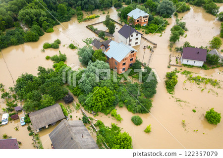 Aerial view of flooded houses with dirty water of Dnister river in Halych town, western Ukraine. Aerial view of flooded houses with dirty water of Dnister river in Halych town, western Ukraine. 122357079