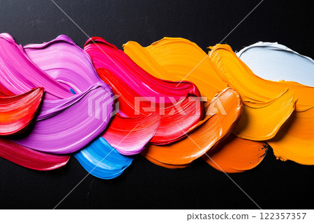 A group of colorful paint strokes on a black background A group of colorful paint strokes on a black background 122357357