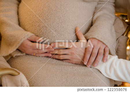 Intimate Moment of Pregnancy with Hands on a Baby Bump 122358076