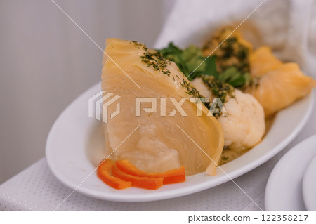 Deliciously Prepared Savory Cabbage Dish Garnished with Herbs and Carrots Deliciously Prepared Savory Cabbage Dish Garnished with Herbs and Carrots 122358217