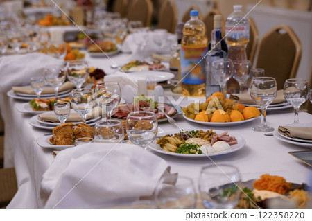 Exquisite Banquet Table Set with an Abundance of Gourmet Delicacies 122358220