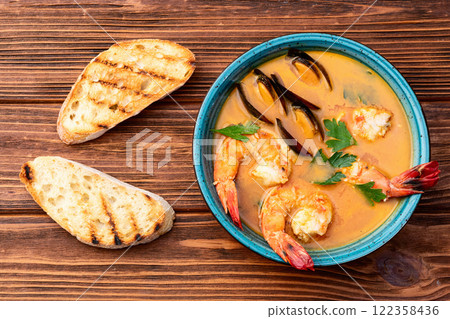 French seafood bouillabaisse soup with shrimps and mussels photography . Top view 122358436