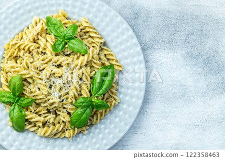 Pasta with basil sauce pesto . Italian food photography . Top view Pasta with basil sauce pesto . Italian food photography . Top view 122358463