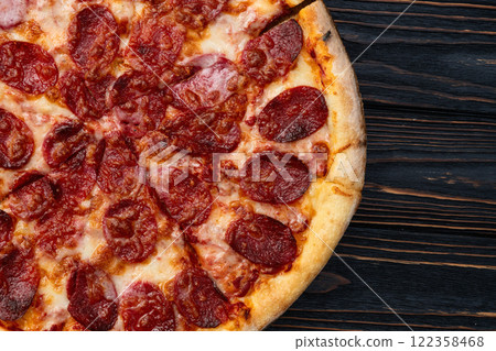Pizza pepperoni fast food . Top view on rustic background 122358468
