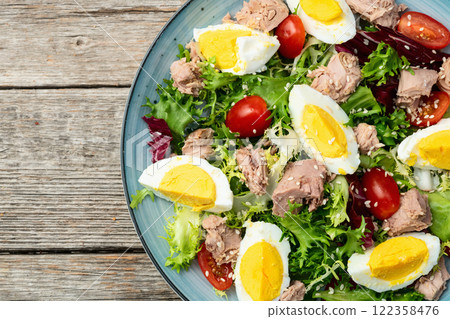 Canned Tuna salad with eggs and tomatoes photography . Top view 122358476