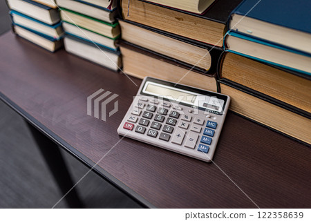 Calculator and book 122358639