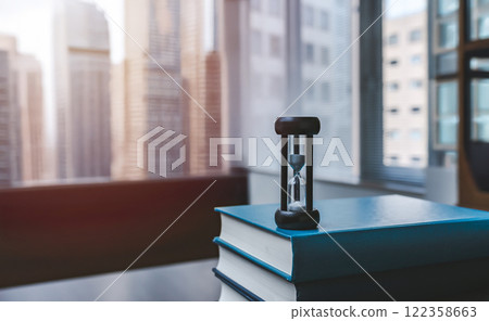 Hourglass and technical book Hourglass and technical book 122358663