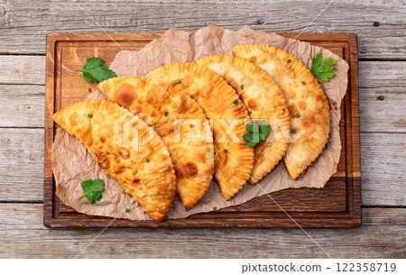 Snack chebureks. Pasties with meat photography . Top view Snack chebureks. Pasties with meat photography . Top view 122358719