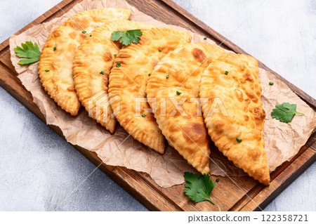 Snack chebureks. Pasties with meat photography . Top view Snack chebureks. Pasties with meat photography . Top view 122358721