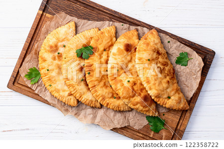 Snack chebureks. Pasties with meat photography . Top view Snack chebureks. Pasties with meat photography . Top view 122358722
