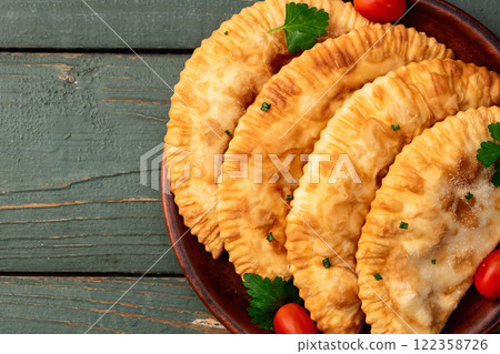 Snack chebureks. Pasties with meat photography . Top view Snack chebureks. Pasties with meat photography . Top view 122358726