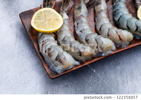 Raw big tiger ( king ) shrimps Cleaned, Peeled & Deveined photography . Top view 122358857