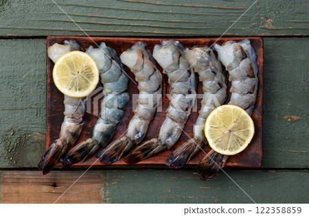 Raw big tiger ( king ) shrimps Cleaned, Peeled & Deveined photography . Top view 122358859