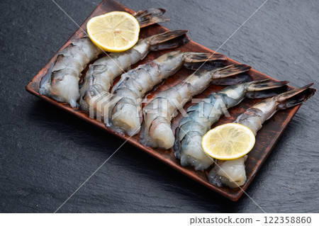 Raw big tiger ( king ) shrimps Cleaned, Peeled & Deveined photography . Top view 122358860