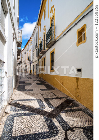 Typical Portuguese facades and cobblestone streets in Elvas, Portugal. Typical Portuguese facades and cobblestone streets in Elvas, Portugal. 122359858
