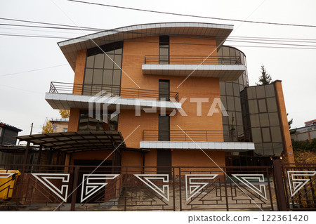 Modern large brick house with balconies 122361420
