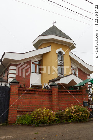 Modern two-storey house made of brick and other materials 122361422