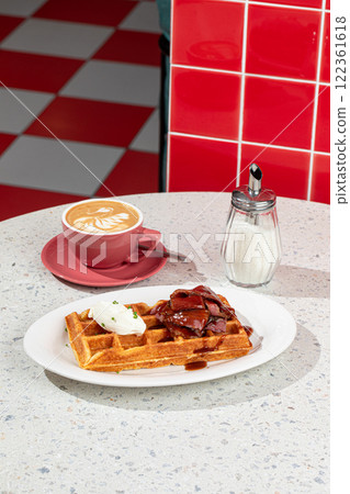 Portion of waffle with brisket and coffee Portion of waffle with brisket and coffee 122361618