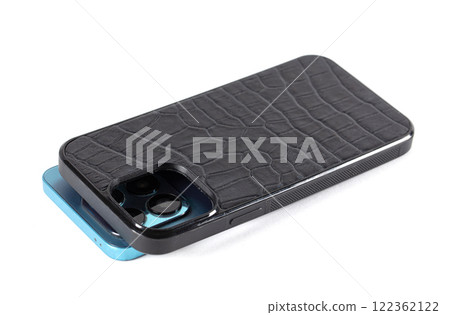 The smartphone case is black crocodile leather on a white background. The smartphone case is black crocodile leather on a white background. 122362122