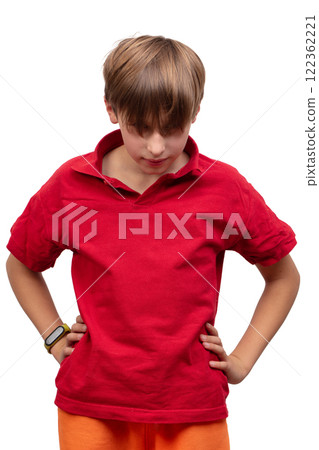 The teenager lowered his bangs, and she closed her eyes. A boy in a red T-shirt peeks out from under his long hair. The teenager lowered his bangs, and she closed her eyes. A boy in a red T-shirt peeks out from under his long hair. 122362221