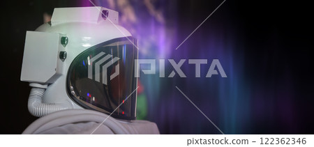 A white astronaut helmet with a purple background A white astronaut helmet with a purple background 122362346