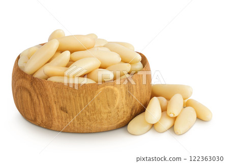 Shelled European pine nuts in wooden bowl isolated on white background with full depth of field 122363030