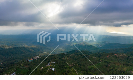 A Majestic and Enchanting Forest Landscape Infused with Warm Sunlight and Soft Clouds 122363039