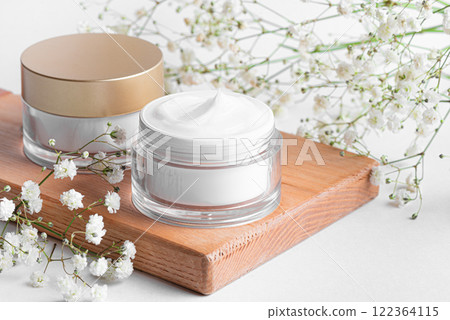 Moisturizer cream jars and gypsophila flowers Moisturizer cream jars and gypsophila flowers 122364115