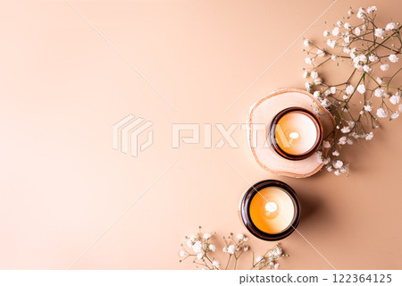 Aroma candles and white gypsophila flowers Aroma candles and white gypsophila flowers 122364125
