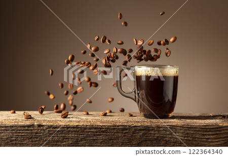 Espresso in glass cup on a old wooden table. 122364340