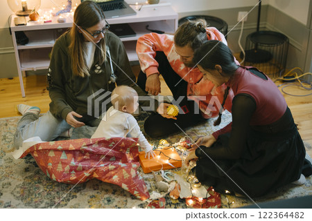 Creating Cherished Family Bonding Moments with a Baby Playing on the Floor at Home 122364482