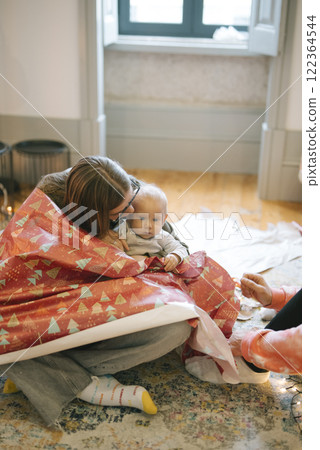 Cozy and Heartwarming Moments Holiday Gift Wrapping Activity with Your Precious Baby 122364544