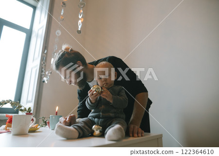 A Heartwarming Father and Child Bonding Moment Decorated with Festive Holiday Decor 122364610
