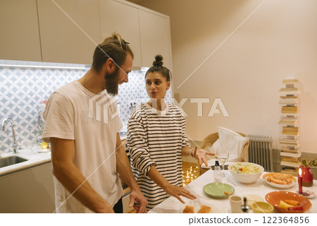 Casual Cooking Together in a Cozy and Modern Kitchen with Friends and Family for Fun 122364856