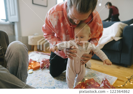 A Joyful Family Moment with a Baby Enjoying the Holidays and Creating Beautiful Memories 122364862