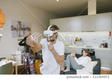Engaging in Exciting and Enjoyable Virtual Reality Fun with Friends and Family Members Engaging in Exciting and Enjoyable Virtual Reality Fun with Friends and Family Members 122364972