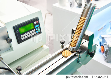 Cookies in machine at confectionery factory Cookies in machine at confectionery factory 122365031