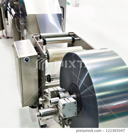 Roll of packaging film on machine food factory 122365047